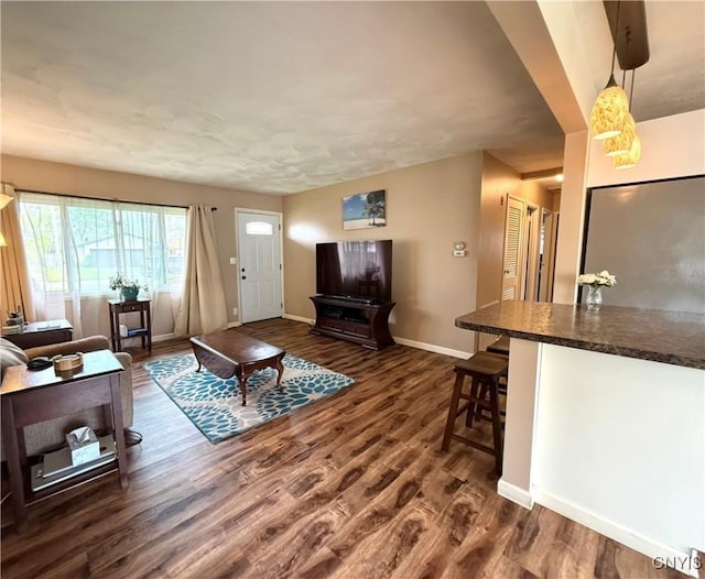1004 W Thomas St, Rome-Inside, NY 13440 - living area featuring baseboards and dark wood finished floors