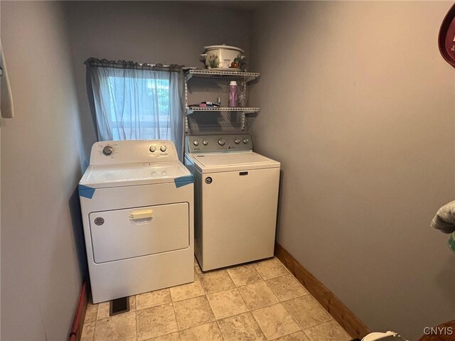 9 Rowley St, Gouverneur, NY 13642 - clothes washing area featuring washer and clothes dryer and baseboards