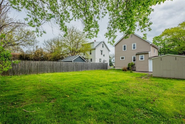 view of yard with an outdoor structure and a storage unit