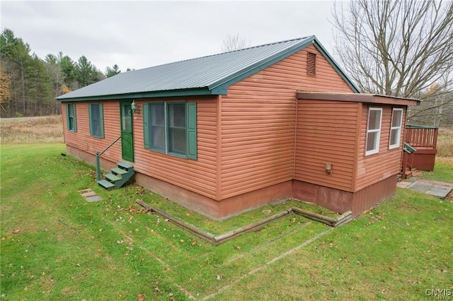 345 Orton Rd, Sandy Creek, NY 13142 - view of home's exterior with entry steps, a lawn, and metal roof