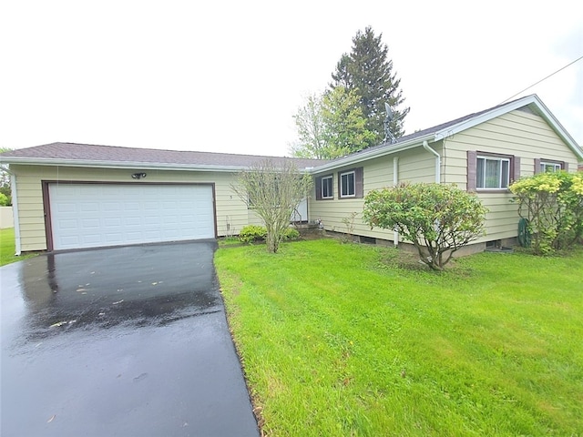 5 Suburban Dr, Big Flats, NY 14903 - ranch-style house featuring asphalt driveway, a garage, and a front lawn