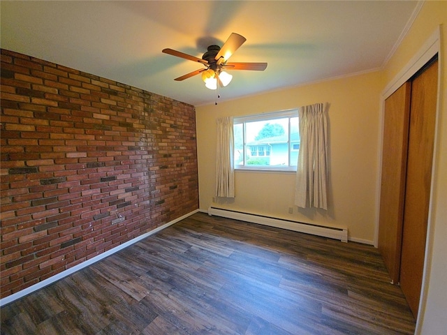 5 Suburban Dr, Big Flats, NY 14903 - unfurnished bedroom featuring brick wall, a baseboard heating unit, dark wood-style flooring, a closet, and baseboards