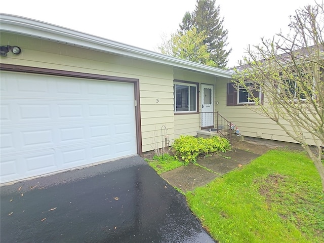 5 Suburban Dr, Big Flats, NY 14903 - ranch-style house featuring driveway and an attached garage