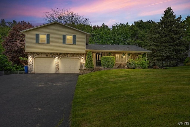 108 Pineledge Rd, Camillus, NY 13031 - split level home featuring stone siding, driveway, a front lawn, and an attached garage
