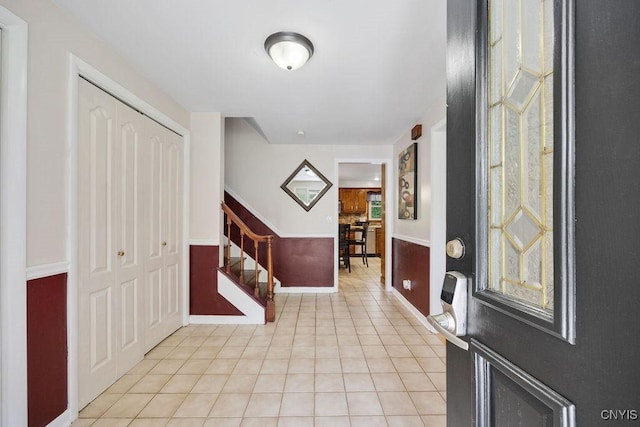 108 Pineledge Rd, Camillus, NY 13031 - foyer with light tile patterned flooring, stairs, and baseboards