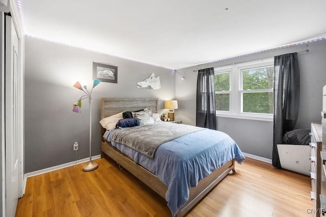 108 Pineledge Rd, Camillus, NY 13031 - bedroom with baseboards and light wood-type flooring