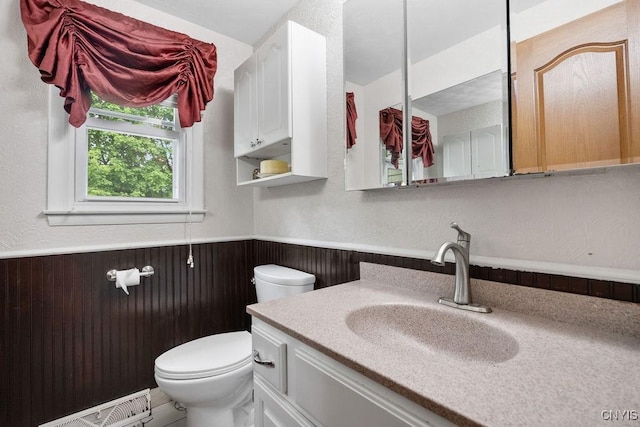 108 Pineledge Rd, Camillus, NY 13031 - bathroom with wainscoting, toilet, vanity, and wood walls