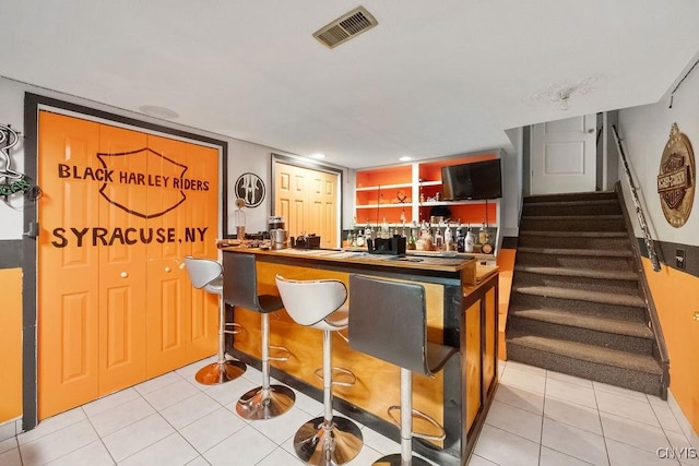 108 Pineledge Rd, Camillus, NY 13031 - indoor wet bar featuring tile patterned floors and stairway