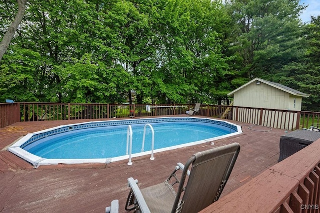 108 Pineledge Rd, Camillus, NY 13031 - view of swimming pool with a wooden deck and view of scattered trees