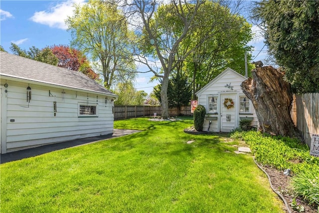 view of yard with an outdoor structure and a storage unit