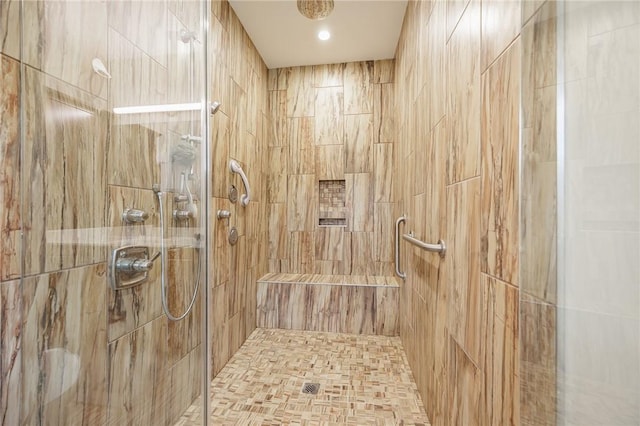 bathroom with a tile shower