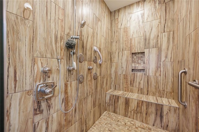 bathroom featuring tiled shower