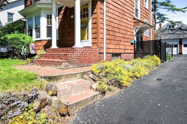 view of exterior entry with a garage