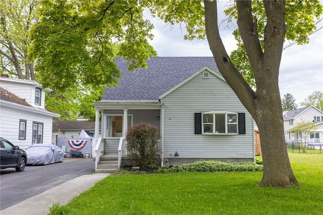 137 Vine St, Batavia-City, NY 14020 - view of front facade with a shingled roof and covered porch