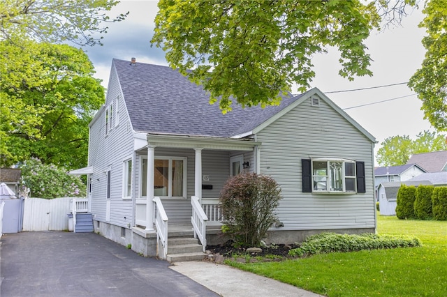 137 Vine St, Batavia-City, NY 14020 - view of front of property featuring a porch, a gate, a front yard, and a shingled roof