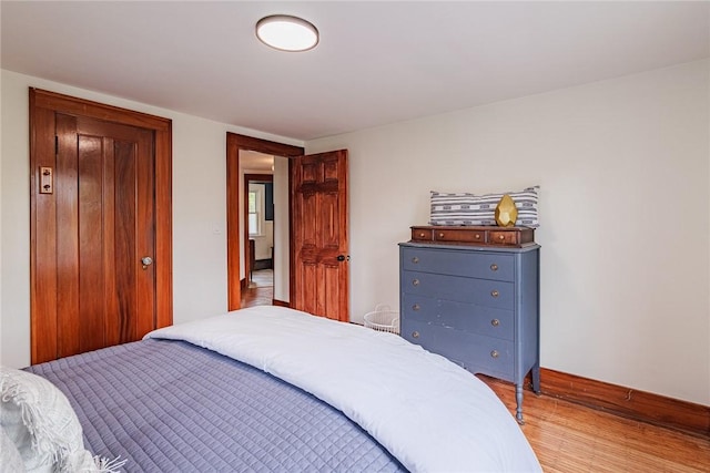 bedroom with light wood-style floors
