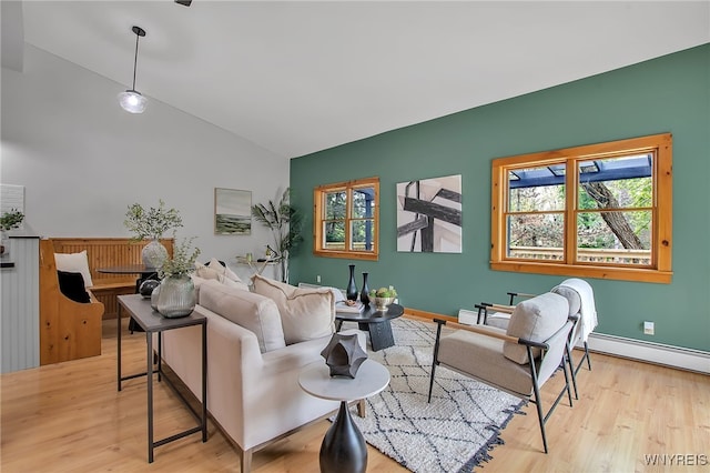9466 Ridge Rd, Hartland, NY 14105 - living room featuring wood finished floors, a baseboard heating unit, high vaulted ceiling, and baseboards