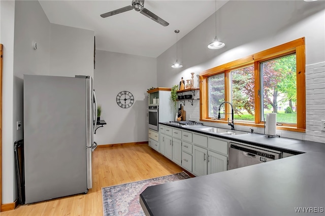 9466 Ridge Rd, Hartland, NY 14105 - kitchen featuring stainless steel appliances, a sink, open shelves, a ceiling fan, and light wood finished floors