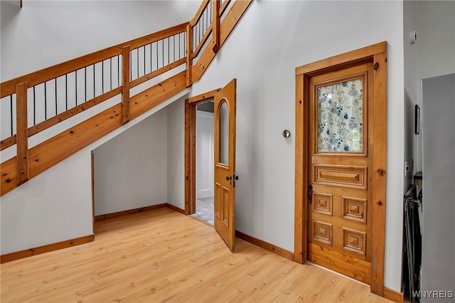9466 Ridge Rd, Hartland, NY 14105 - foyer with wood finished floors, baseboards, and stairway