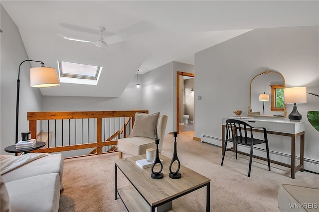 9466 Ridge Rd, Hartland, NY 14105 - living room featuring a ceiling fan, carpet floors, a skylight, lofted ceiling, and a baseboard radiator
