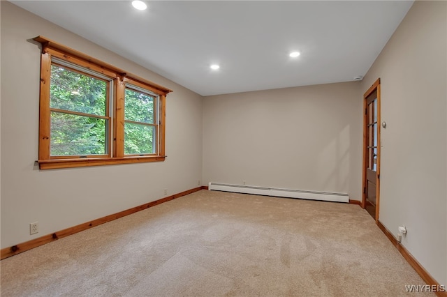 9466 Ridge Rd, Hartland, NY 14105 - spare room featuring a baseboard radiator, carpet, baseboards, and recessed lighting