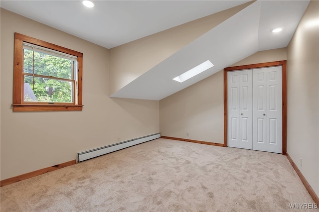 9466 Ridge Rd, Hartland, NY 14105 - bonus room featuring a baseboard heating unit, a skylight, light carpet, baseboards, and recessed lighting