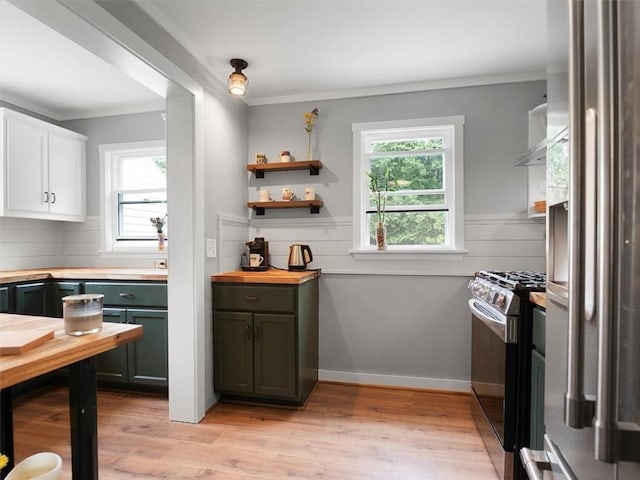 kitchen featuring appliances with stainless steel finishes, wooden counters, white cabinets, open shelves, and light wood finished floors