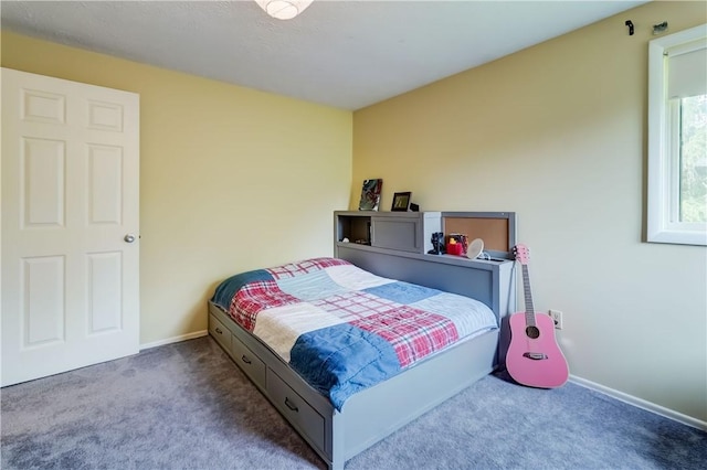 carpeted bedroom with baseboards
