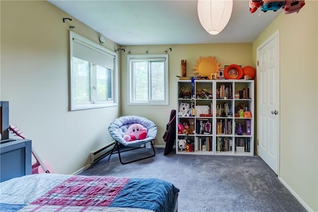 carpeted bedroom featuring a baseboard radiator and baseboards
