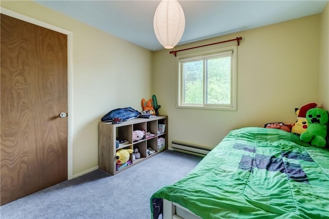 carpeted bedroom with a baseboard heating unit