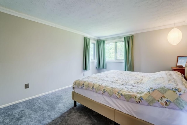 bedroom with carpet, baseboards, and crown molding