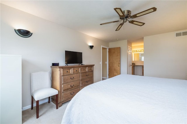 bedroom featuring light colored carpet, baseboards, and a ceiling fan