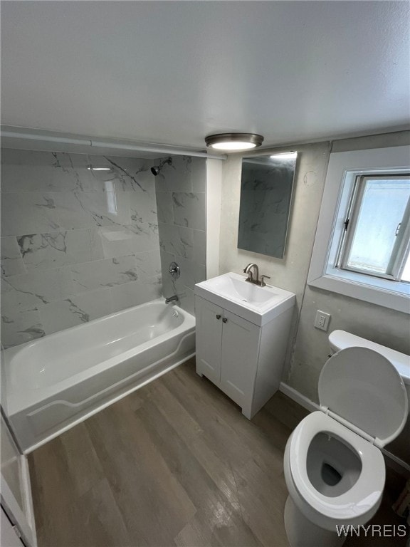 1597 Franklin St, Newfane, NY 14126 - bathroom featuring wood finished floors, vanity, bathtub / shower combination, and toilet