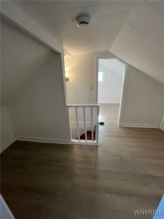 1597 Franklin St, Newfane, NY 14126 - additional living space featuring wood finished floors, vaulted ceiling, and baseboards
