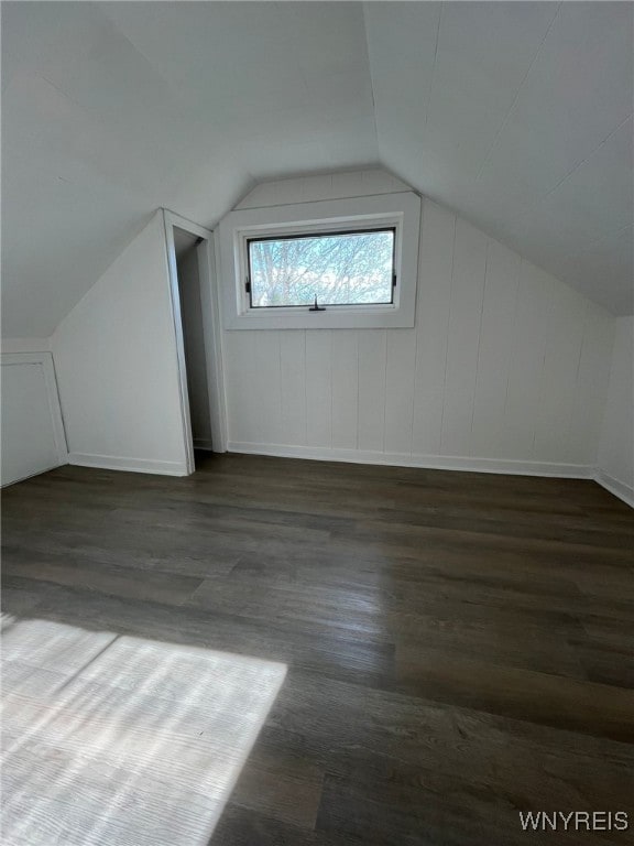 1597 Franklin St, Newfane, NY 14126 - additional living space featuring wood finished floors, vaulted ceiling, and baseboards
