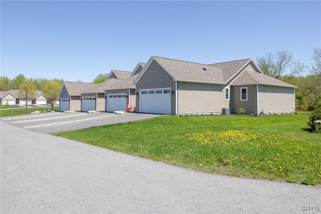4490 Lauder Ln, Skaneateles, NY 13152 - view of property exterior featuring a lawn, central air condition unit, and a shingled roof