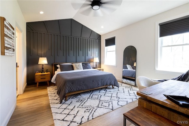 4490 Lauder Ln, Skaneateles, NY 13152 - bedroom featuring lofted ceiling, light wood-style flooring, baseboards, a ceiling fan, and recessed lighting