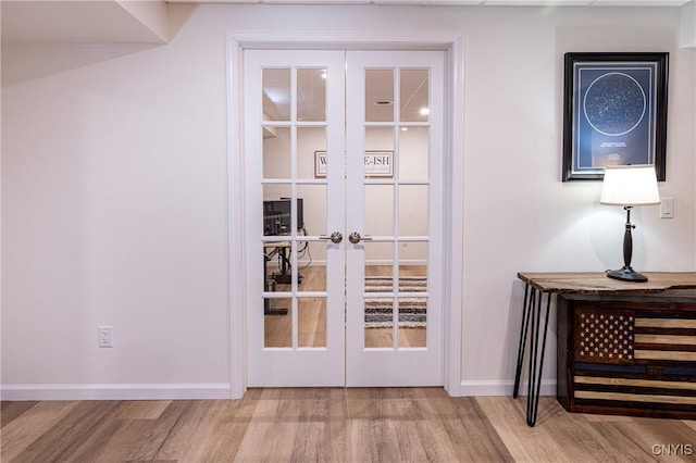 4490 Lauder Ln, Skaneateles, NY 13152 - doorway with french doors, wood finished floors, and baseboards