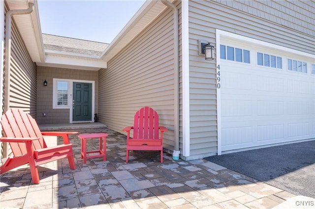 4490 Lauder Ln, Skaneateles, NY 13152 - view of patio / terrace with a garage