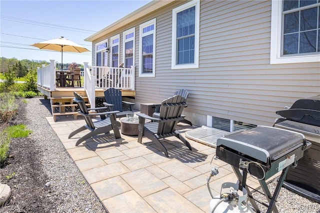 4490 Lauder Ln, Skaneateles, NY 13152 - view of patio featuring a fire pit and a deck