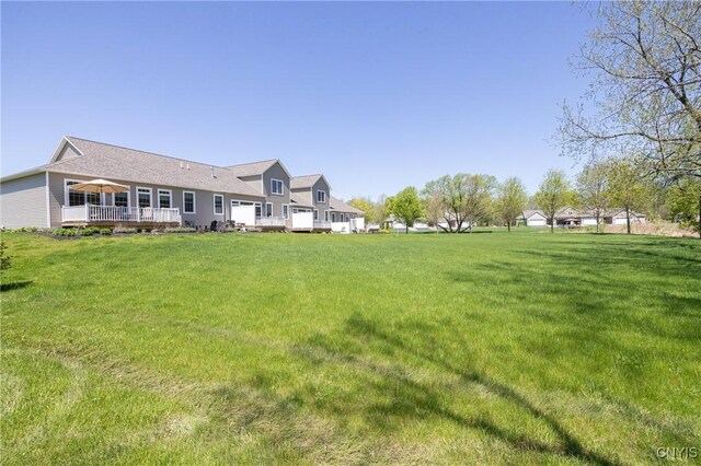 4490 Lauder Ln, Skaneateles, NY 13152 - rear view of property with a deck and a yard