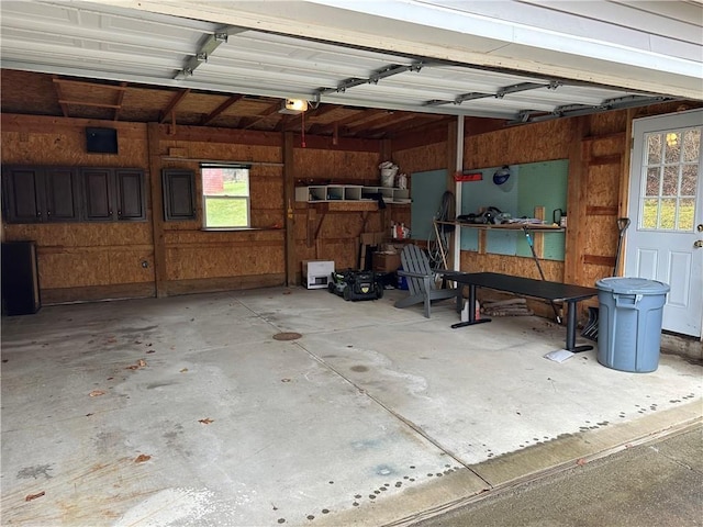 407 Gifford St, Hornellsville, NY 14843 - garage with a garage door opener and wooden walls