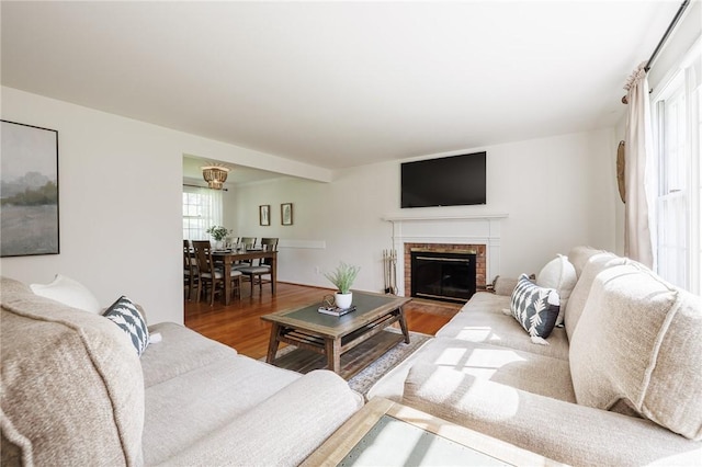 living room featuring wood finished floors and a fireplace