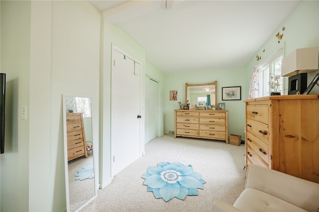 bedroom featuring light carpet