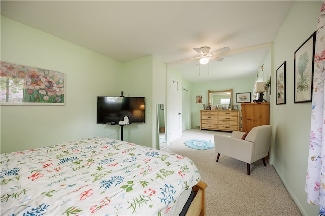 carpeted bedroom featuring ceiling fan