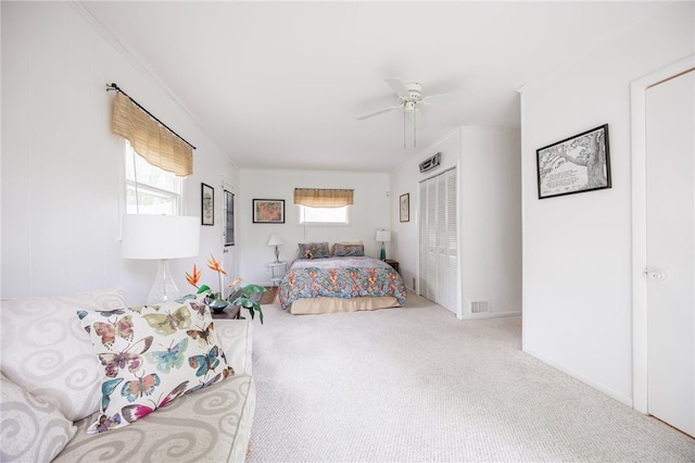 bedroom with carpet, a closet, and ceiling fan