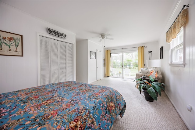 carpeted bedroom featuring access to exterior, ceiling fan, and a closet
