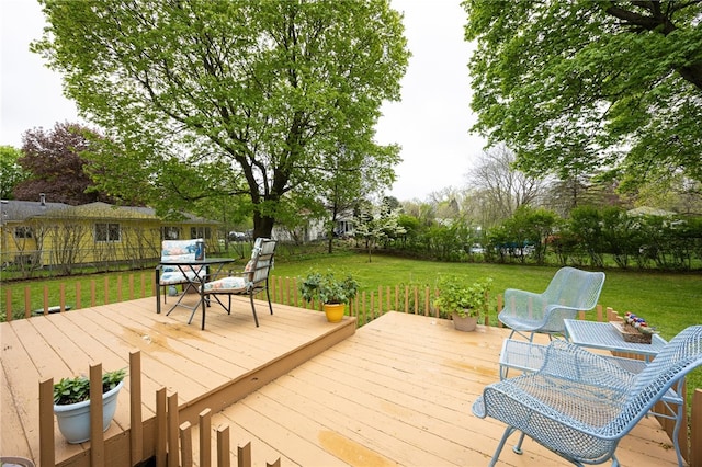 wooden deck with outdoor dining space
