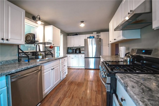 1934 E Middle Rd, Sheridan, NY 14136 - kitchen with stainless steel appliances, a sink, white cabinets, and dark wood-style flooring