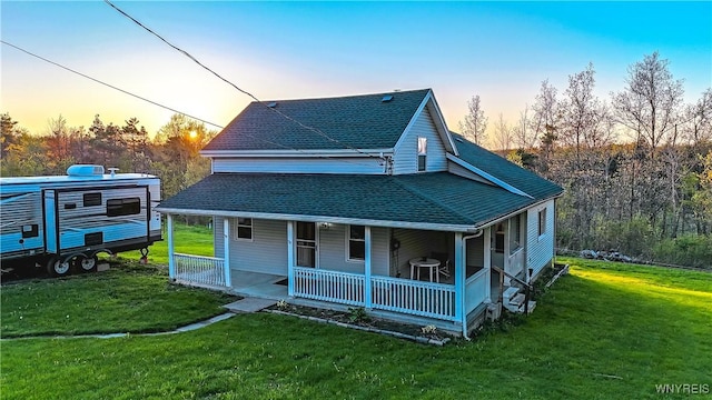 1934 E Middle Rd, Sheridan, NY 14136 - view of front of home featuring a shingled roof, covered porch, and a lawn